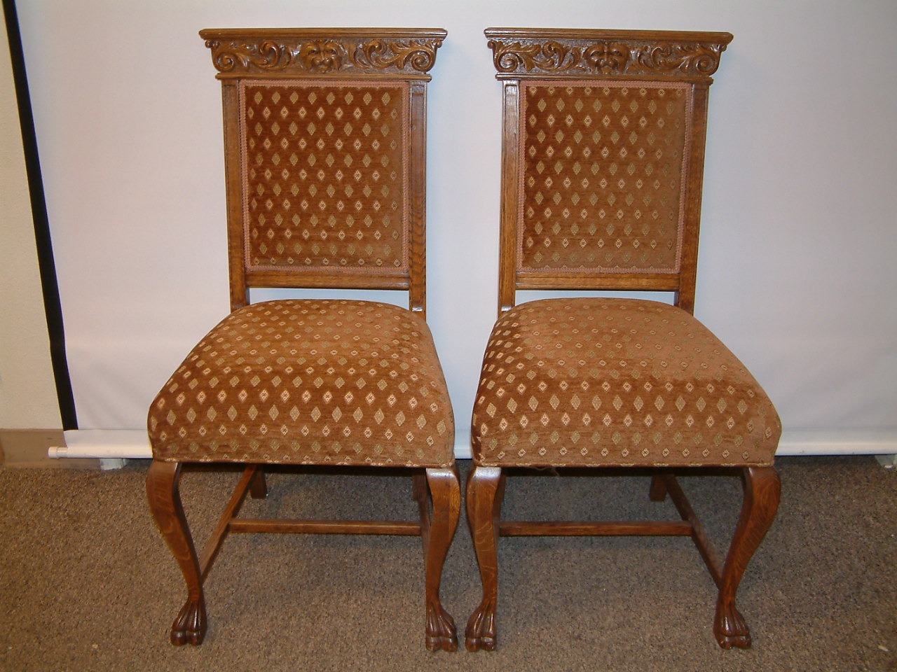 fancy carved oak griffin adorned dining chairs